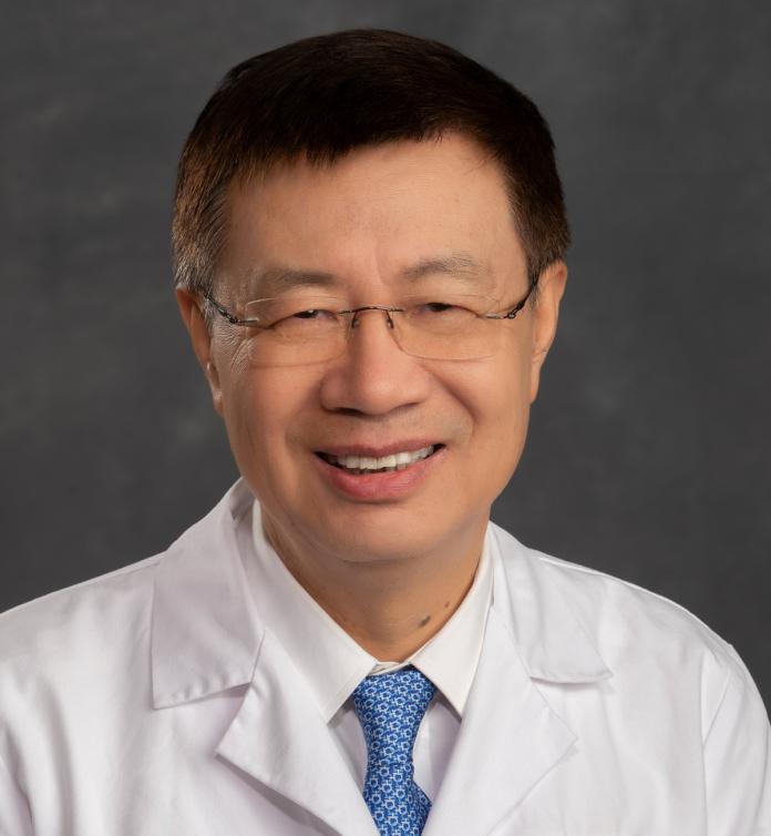 A photo of Guang-Yu Yang, MD, PhD.